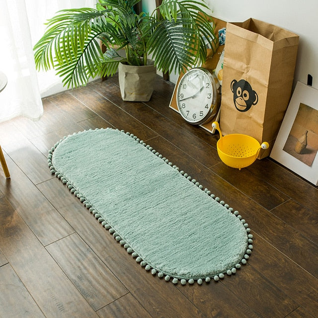 Pom-pom Trimmed Oval Anti-skid Rug