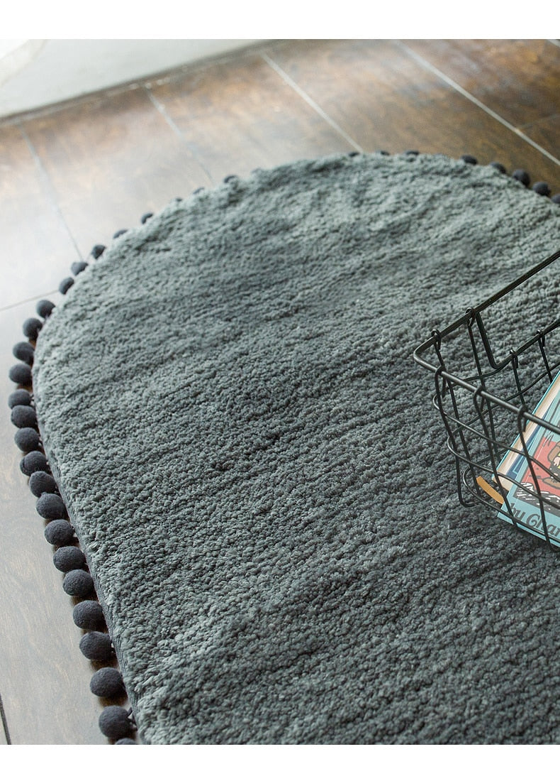 Pom-pom Trimmed Oval Anti-skid Rug